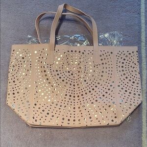 Large Tan Tote Bag with Intricate Perforated Design and Sturdy Handles
